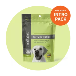 Image of the green front of the Intro Pack size bag of Treatibles Soft Chewables for Dogs with raw beef liver cubes to the side of the image