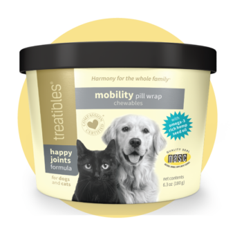 Image of front of the light yellow canister of Treatibles Happy Joints Mobility Pill Wrap Chewables for Dogs and Cats featuring a black cat and golden retriever.