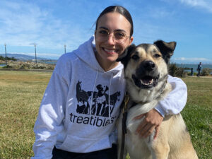 Image of Treatibles Brand Coordinator Dominique and her big smiley dog Sapper