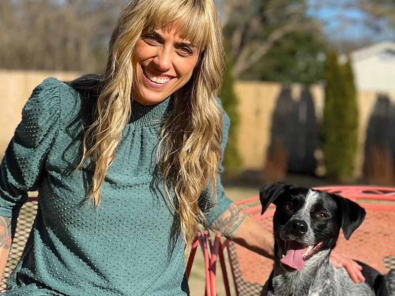 Julianna Carella posing with her pup Delilah